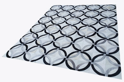 Custom made cowhide area rugs. Patchwork cowhides