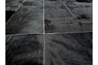 Black cowhide rug with White stitching