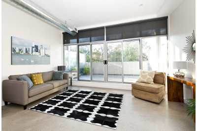 Black and white puzzle cowhide rug