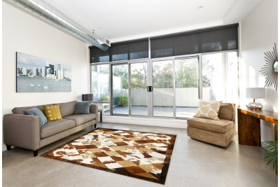 Brown and white rhombuses cowhide rug
