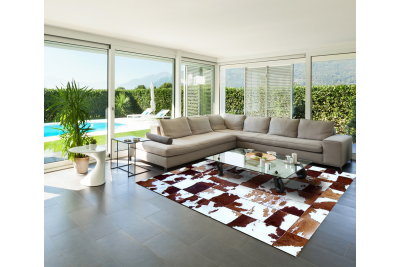 Brown and white cowhide rug