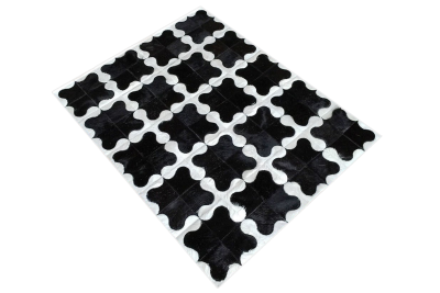 Black and white puzzle cowhide rug