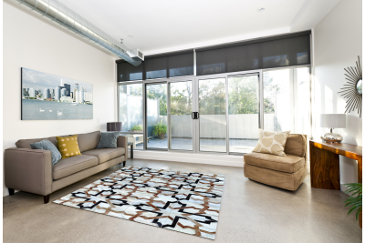 White, black and beige modern cowhide rug