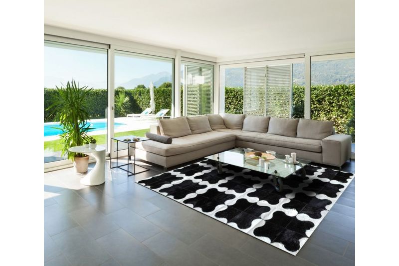Black and white puzzle cowhide rug