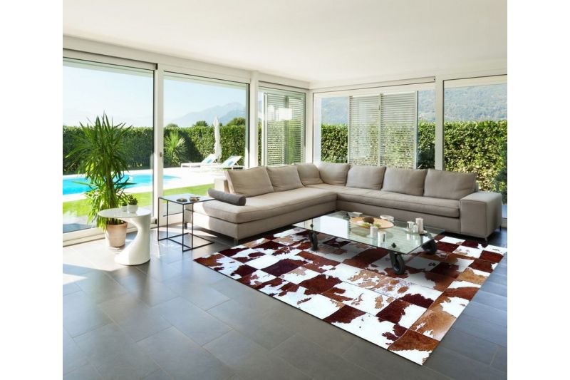 Brown and white cowhide rug