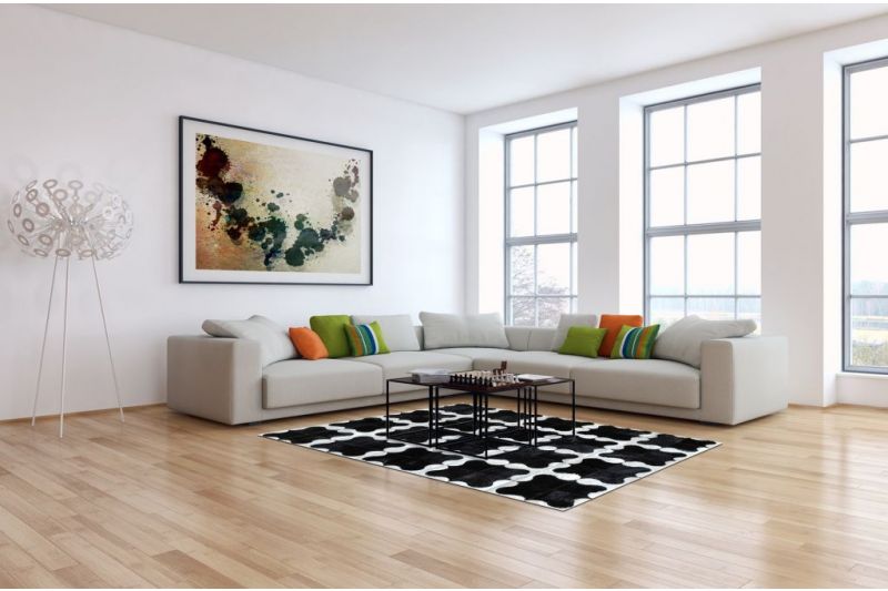 Black and white puzzle cowhide rug