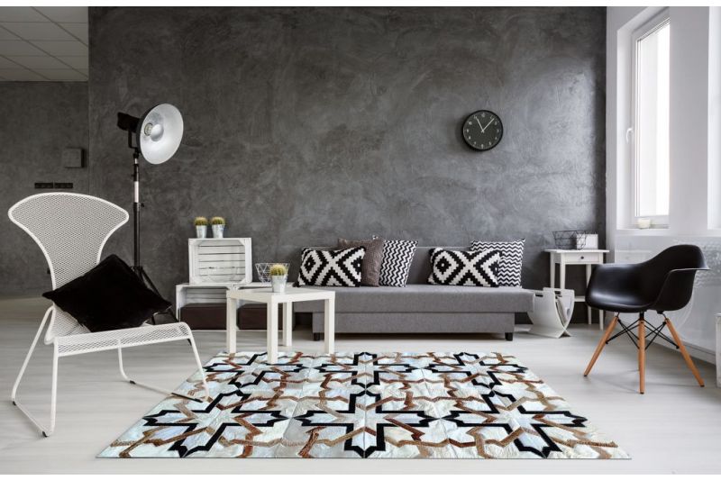 White, black and beige modern cowhide rug