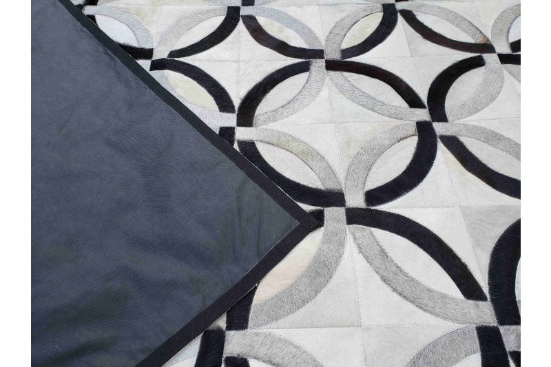 White, black and grey chain cowhide rug